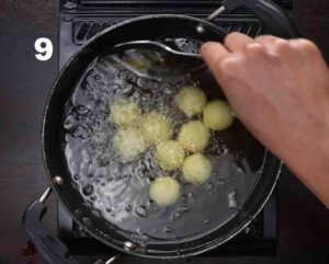 dip the gulab jamun into the warm sugar syrup